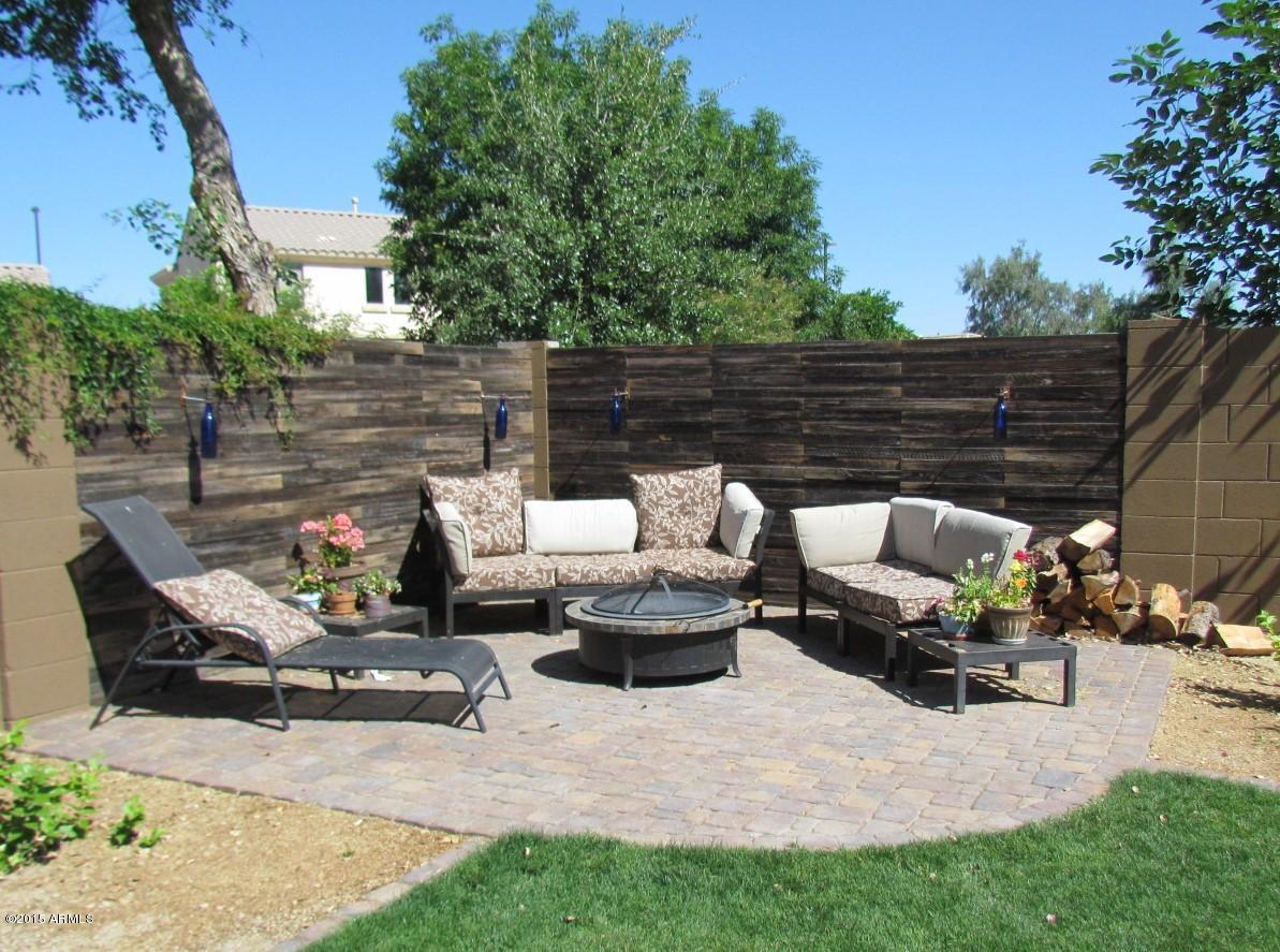 4720 East Timberline Road Gilbert, AZ 85297 - Photo 24 of 39 a view of a patio with couches and a fire pit