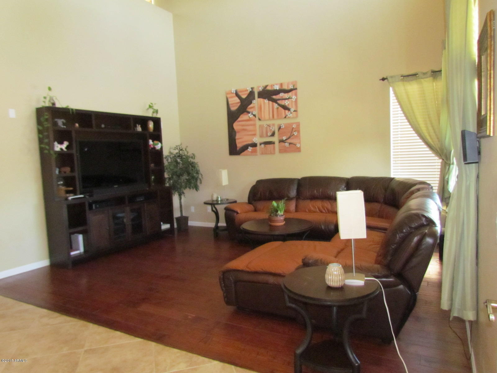4720 East Timberline Road Gilbert, AZ 85297 - Photo 5 of 39 a living room with furniture and a flat screen tv