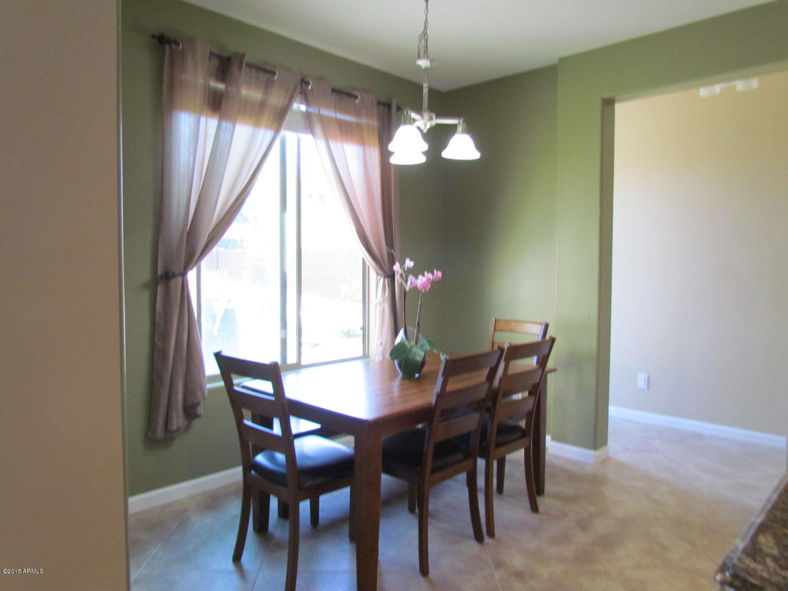 4720 East Timberline Road Gilbert, AZ 85297 - Photo 8 of 39 a view of a dining room with furniture window and outside view
