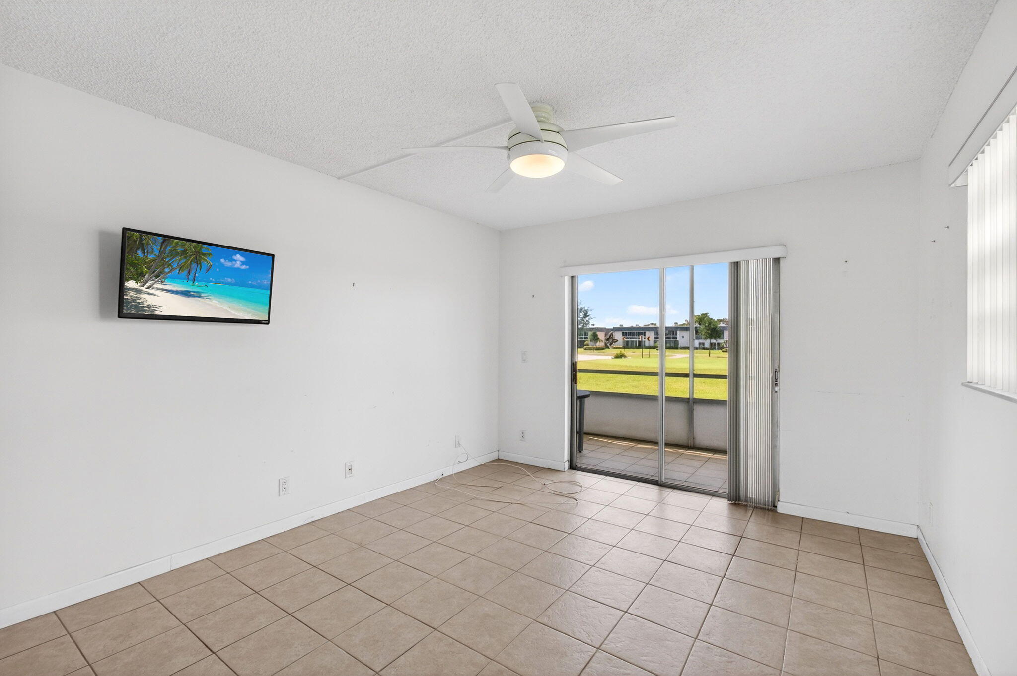 167 Normandy Lane, Unit D Delray Beach, FL 33484 - Photo 23 of 46 Bedroom with TV