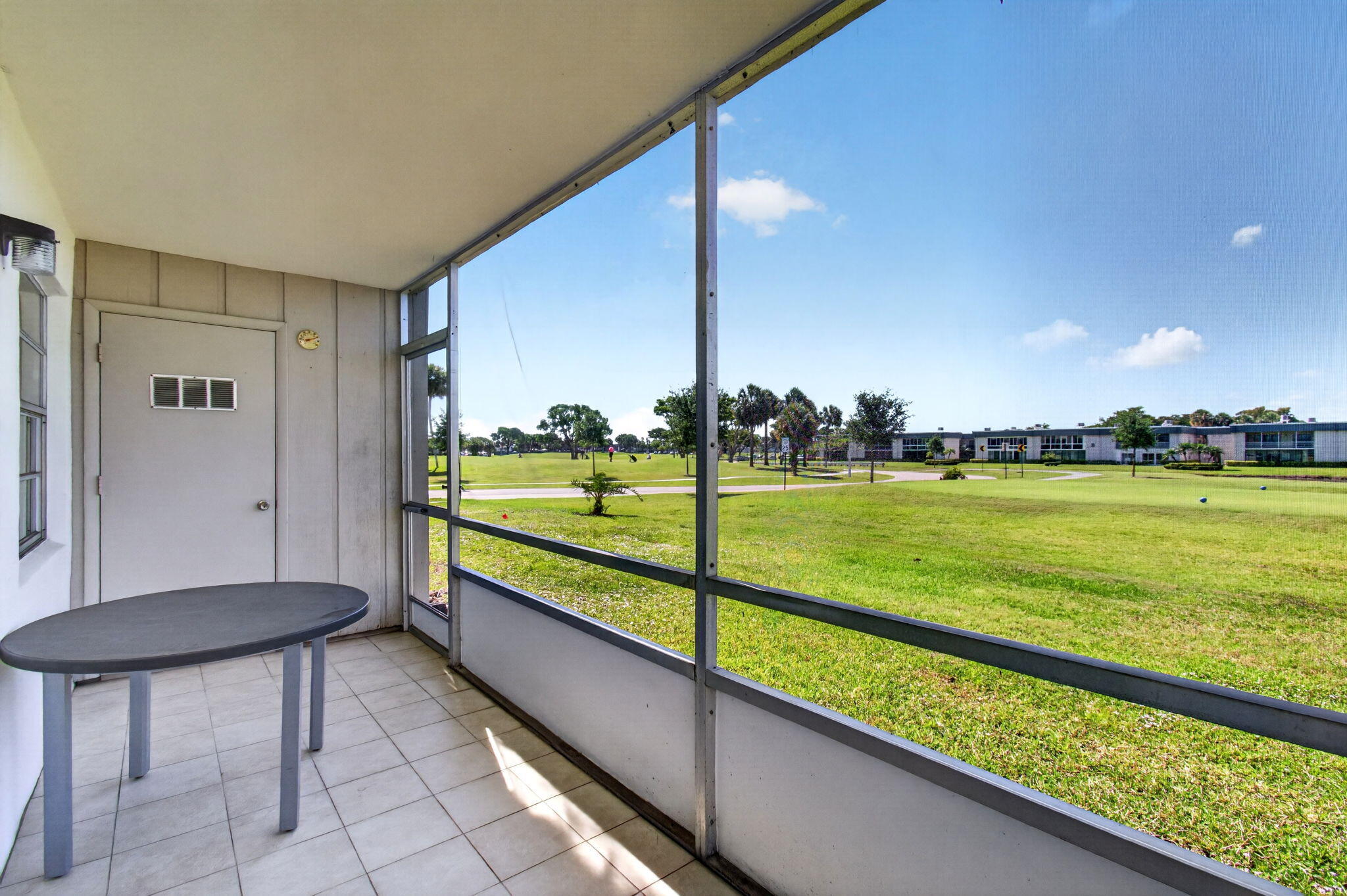 167 Normandy Lane, Unit D Delray Beach, FL 33484 - Photo 30 of 46 Patio with Golf Views