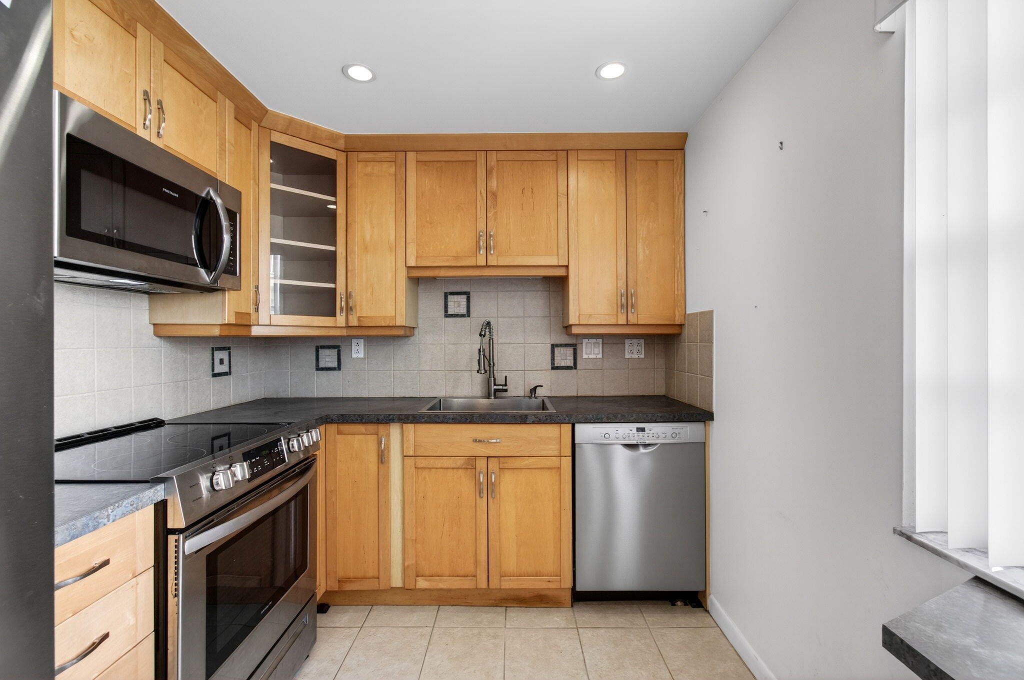 167 Normandy Lane, Unit D Delray Beach, FL 33484 - Photo 5 of 46 Spacious Kitchen with Sleek Counters