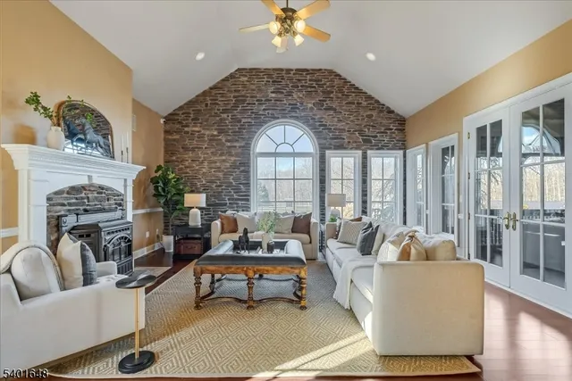 a living room with furniture and a fireplace