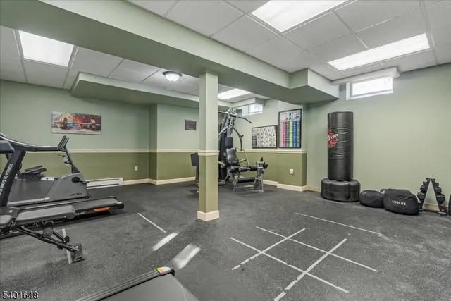 a dining room with furniture and a wooden floor