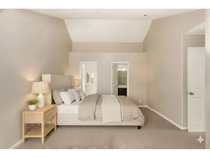 a living room with furniture and a lamp