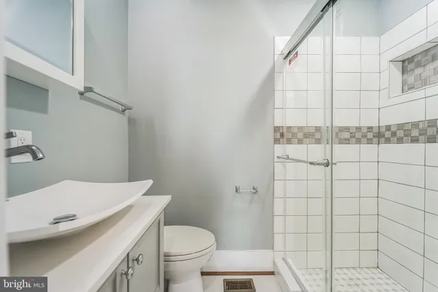 a bathroom with a sink and toilet