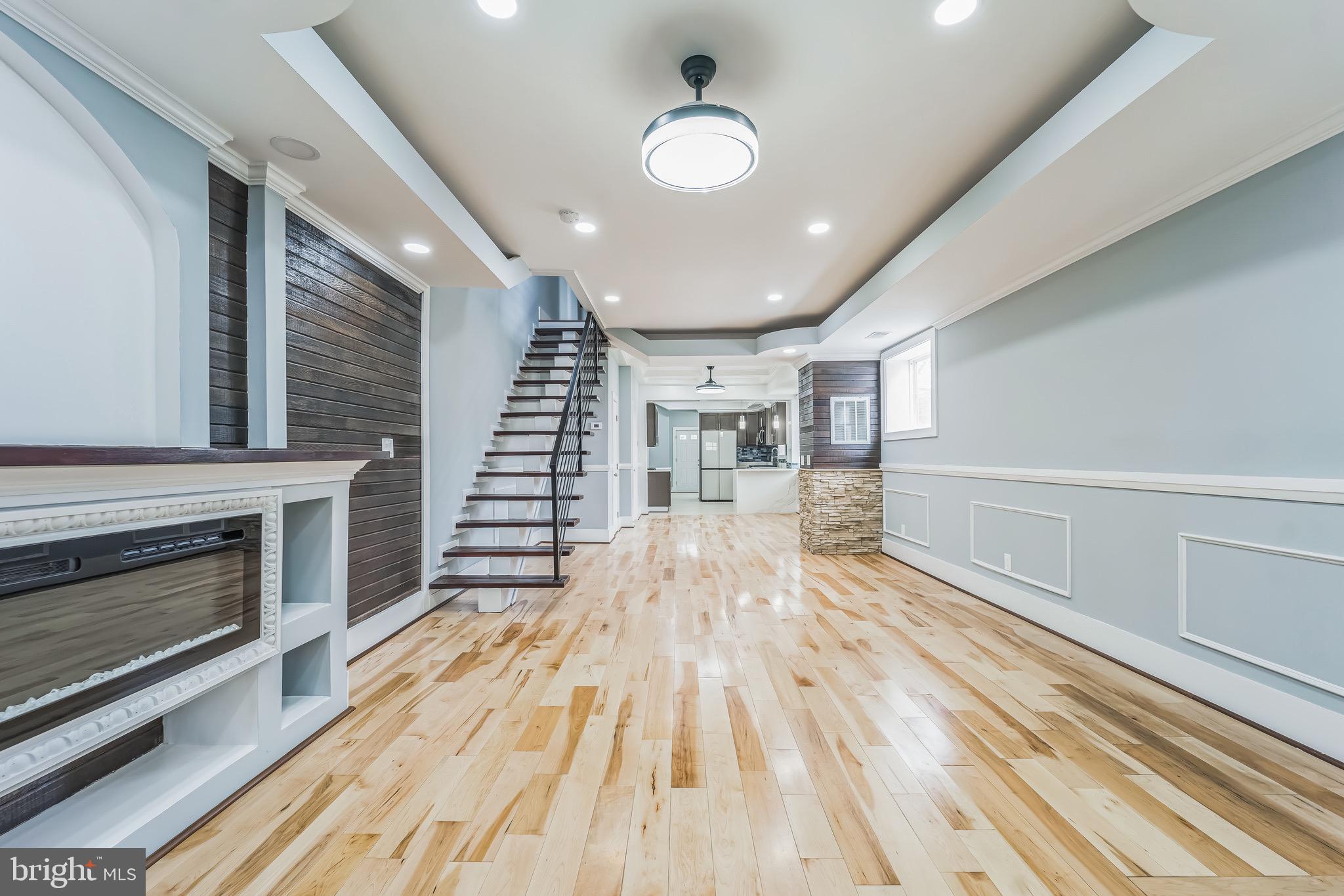 1036 Poplar Grove Street Baltimore, MD 21216 - Photo 4 of 24 a view of a livingroom with wooden floor