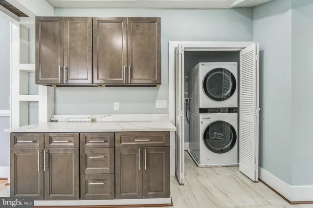 a utility room with a sink a washer and dryer
