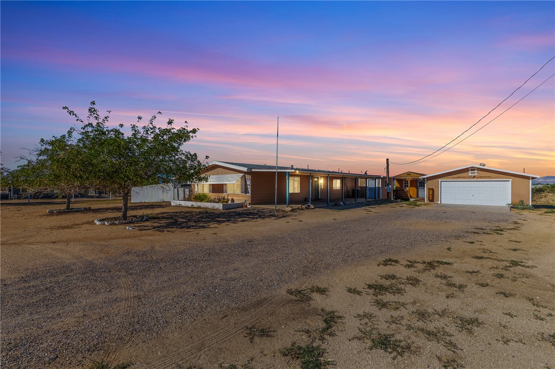3475 Adobe Road Golden Valley, AZ 86413 - Photo 1 of 71 View of front of property featuring a garage and driveway