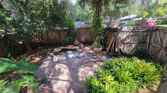 a backyard of a house with lots of green space