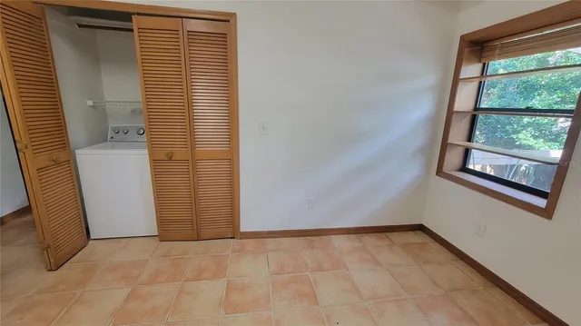 a view of an empty room with a window