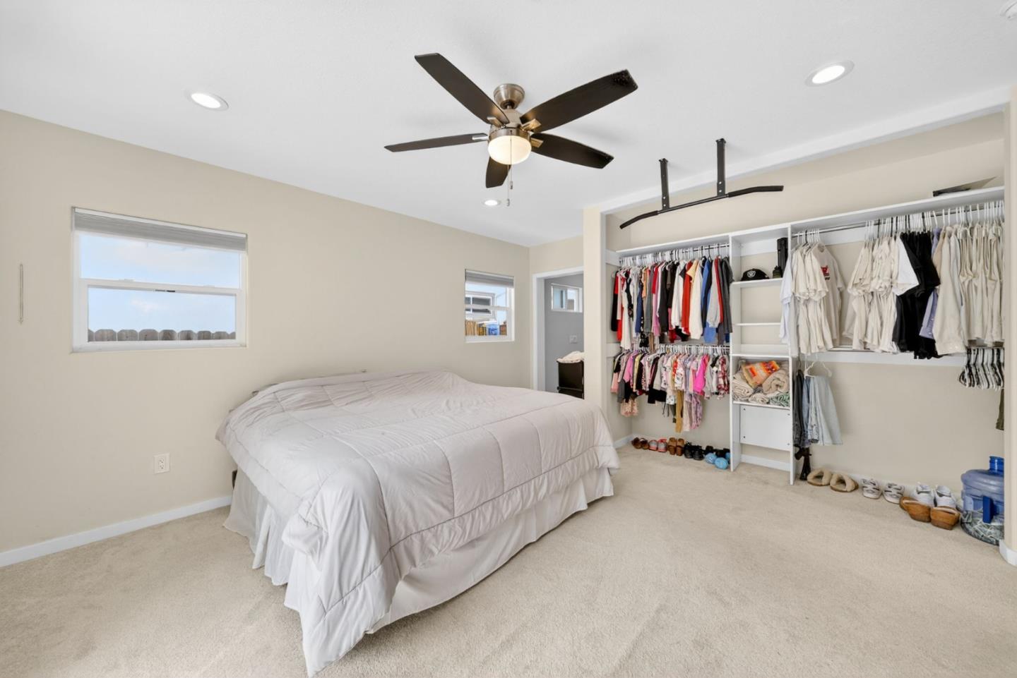 919 Old Canyon Road Fremont, CA 94536 - Photo 17 of 55 a bedroom with bed and ceiling fan