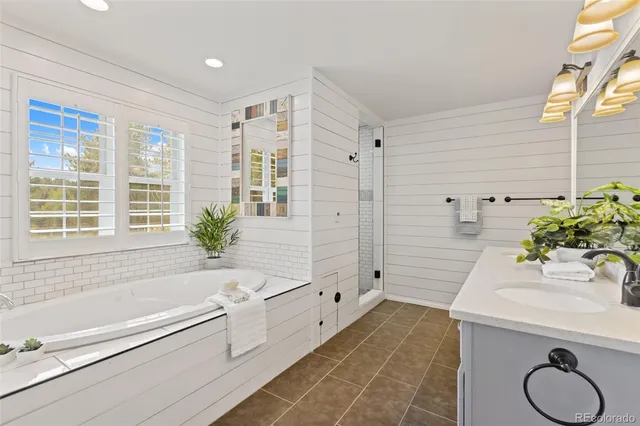 a bathroom with a sink vanity granite and a mirror