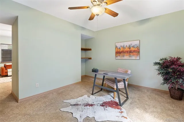 a view of a livingroom with furniture and window