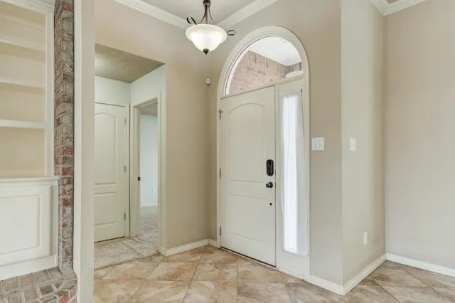 an empty room with mirror in it