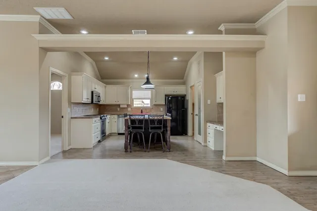 a view of a kitchen and dining room