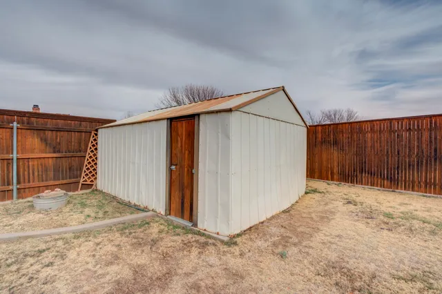 a view of backyard and garage