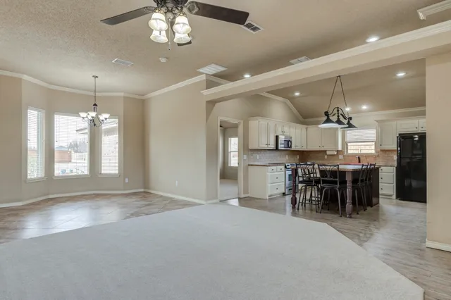 a view of a kitchen and dining room