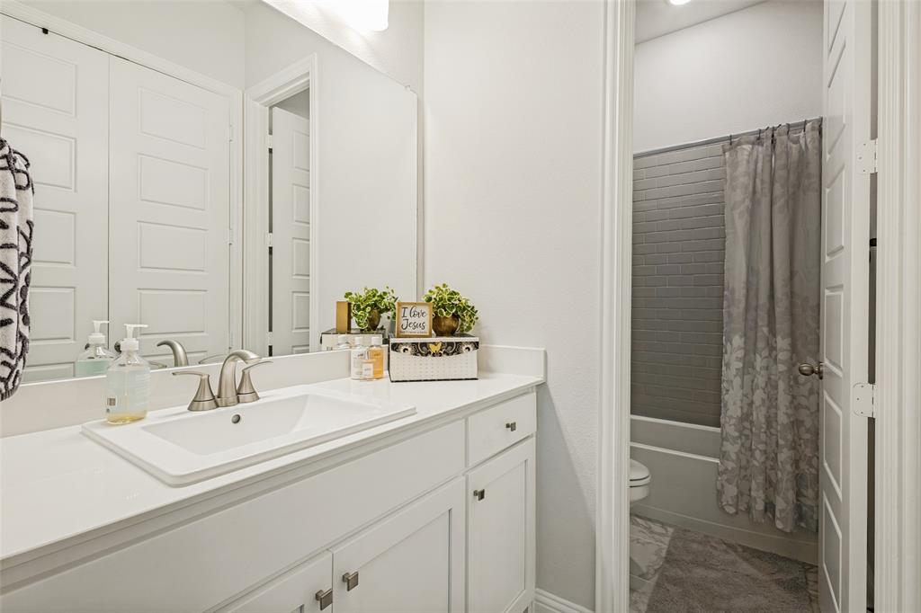 1508 Bear Path Way Gunter, TX 75058 - Photo 12 of 25 a bathroom with a sink and a mirror