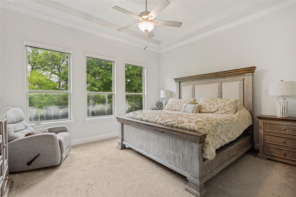 1508 Bear Path Way Gunter, TX 75058 - Photo 13 of 25 a spacious bedroom with a bed and a large window