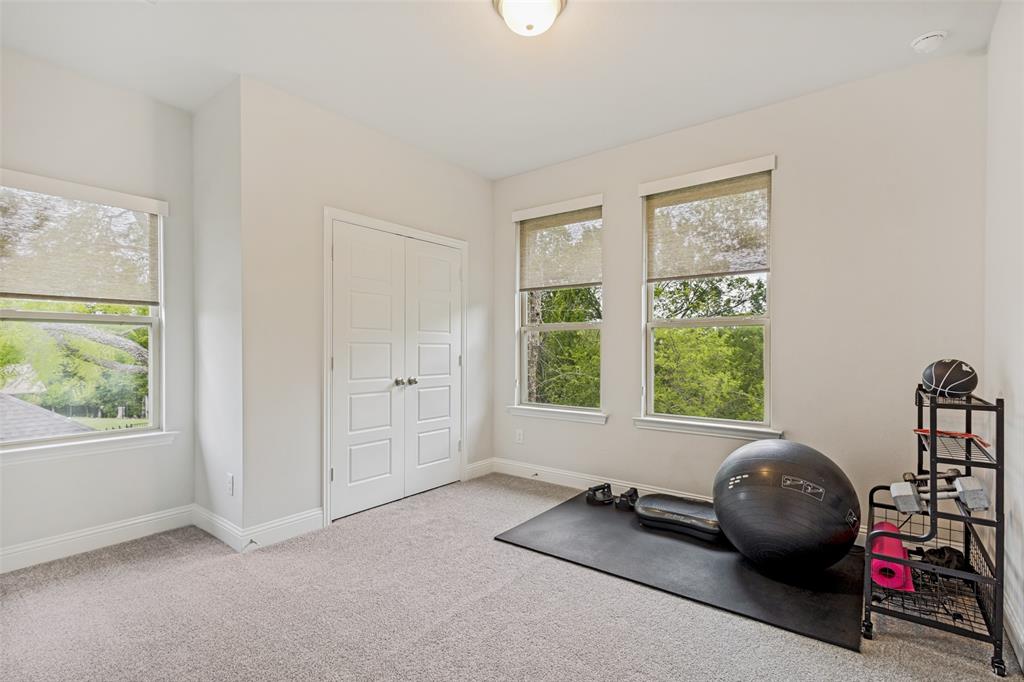 1508 Bear Path Way Gunter, TX 75058 - Photo 16 of 25 a room with a window and a bicycle
