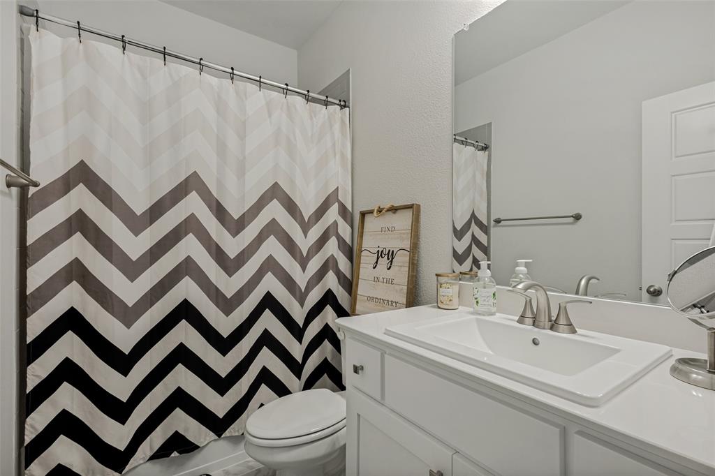 1508 Bear Path Way Gunter, TX 75058 - Photo 19 of 25 a bathroom with a sink and a mirror