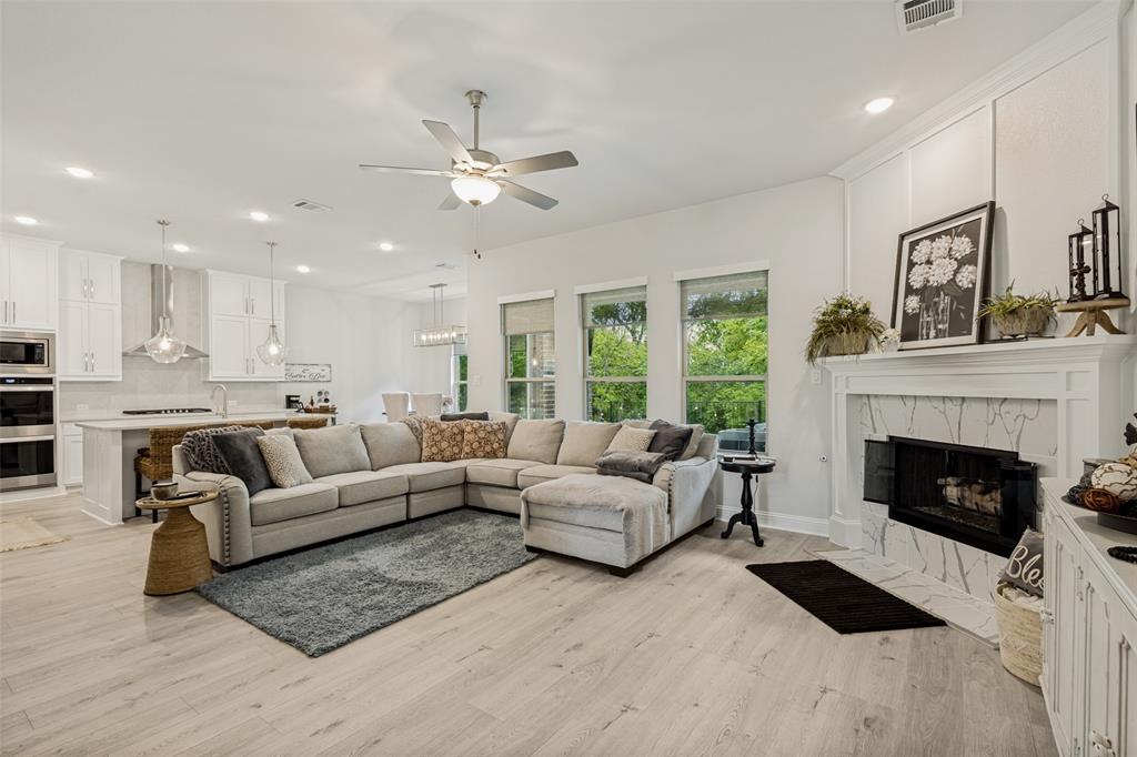 1508 Bear Path Way Gunter, TX 75058 - Photo 5 of 25 a living room with furniture and a fireplace