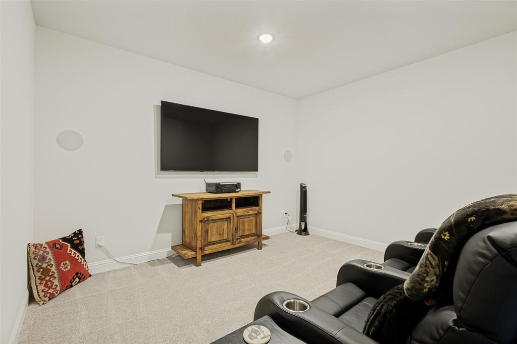 1508 Bear Path Way Gunter, TX 75058 - Photo 9 of 25 a living room with furniture and a flat screen tv