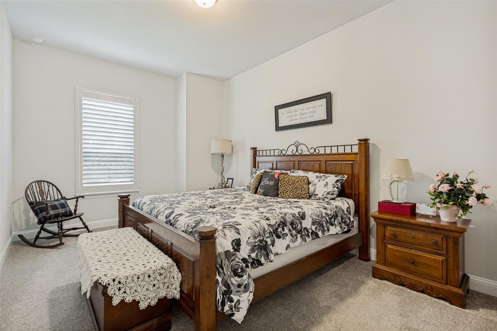 1508 Bear Path Way Gunter, TX 75058 - Photo 10 of 25 a bedroom with a bed and chair
