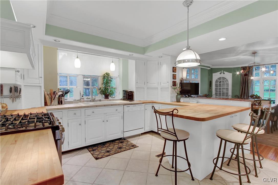 414 South Tulpehocken Road Reading, PA 19601 - Photo 11 of 41 a kitchen with stainless steel appliances kitchen island a chandelier and view of living room