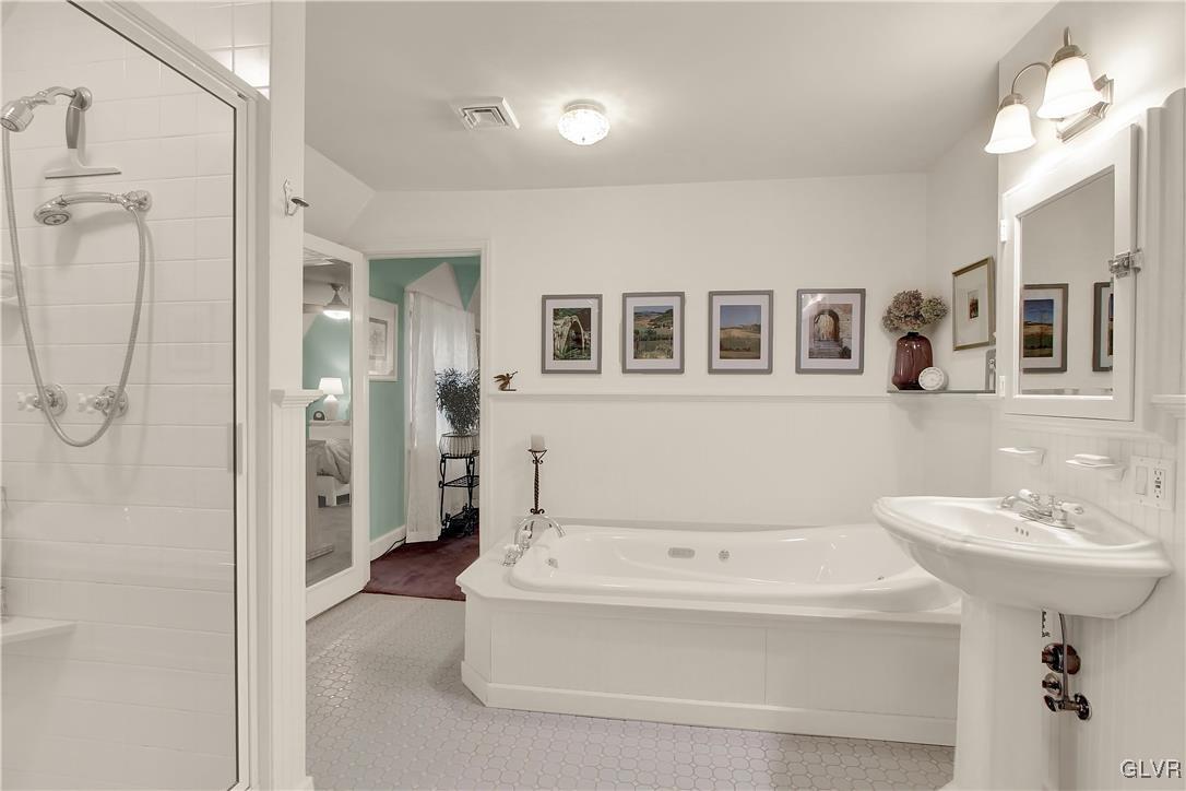 414 South Tulpehocken Road Reading, PA 19601 - Photo 29 of 41 a bathroom with a sink a mirror and a shower