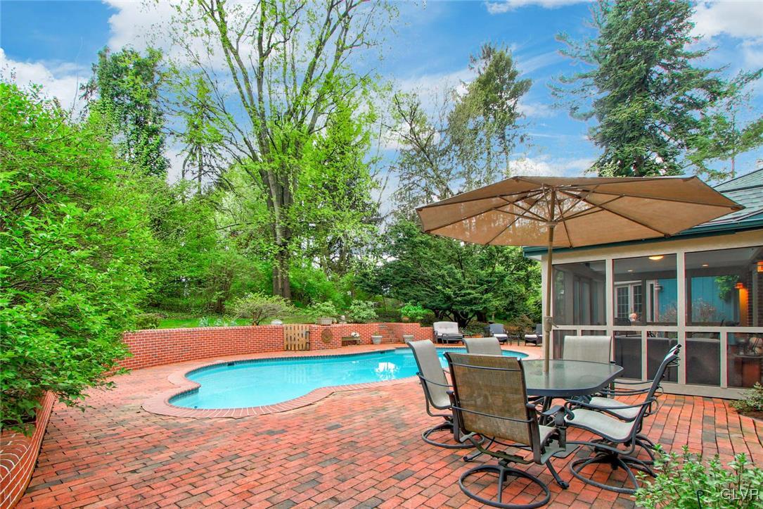 414 South Tulpehocken Road Reading, PA 19601 - Photo 31 of 41 a patio with table and chairs under an umbrella
