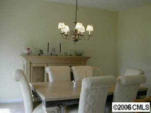 627 Eaton Court Fort Mill, SC 29708 - Photo 3 of 8 a view of a dining room with furniture and chandelier