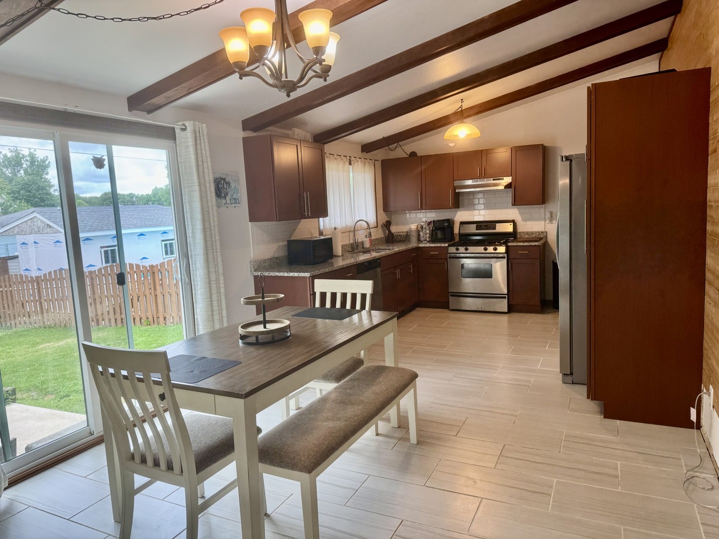 903 West 1st Street Spring Valley, IL 61362 - Photo 8 of 16 a kitchen with granite countertop a stove and cabinets