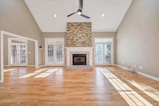 a white bath tub sitting in a bathroom next to a window