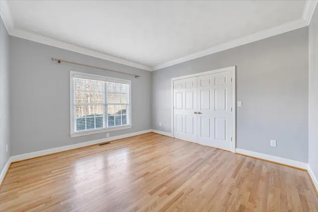 a view of a balcony with wooden floor