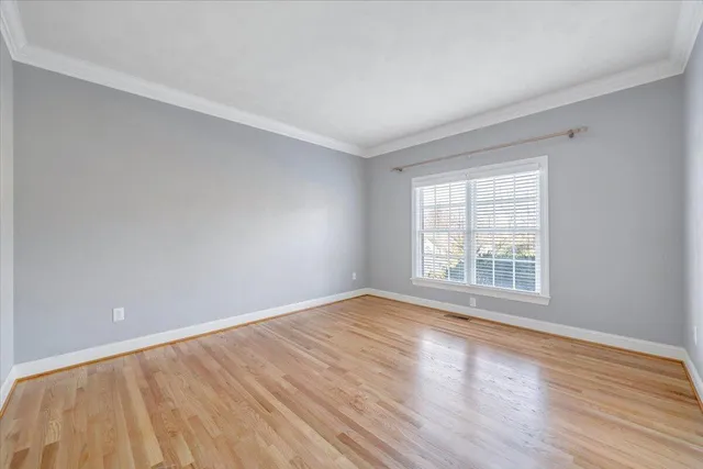 a view of a balcony with wooden floor
