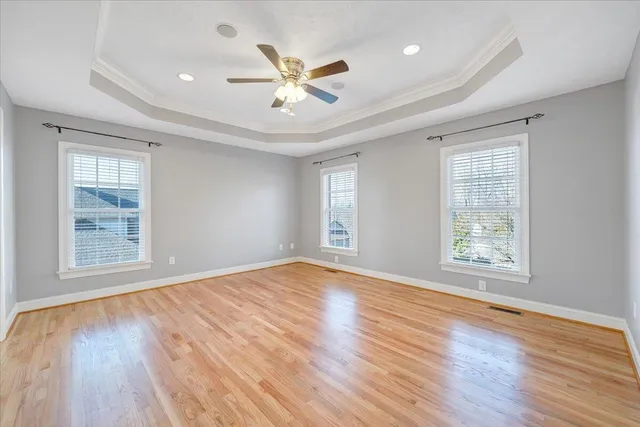 a view of a balcony with wooden floor and fence