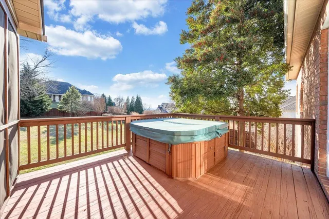 a hallway with sink and mirror