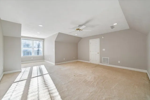 a view of a house with a yard and garage