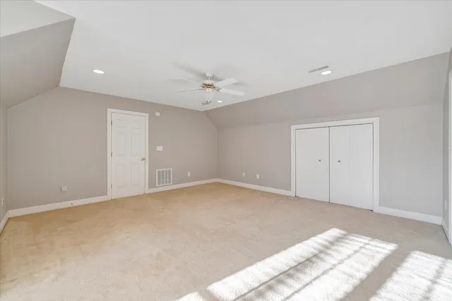 a view of a house with a yard and pathway