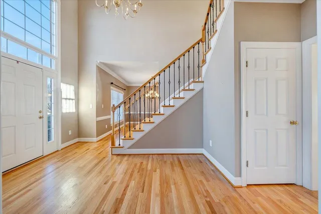 a kitchen with stainless steel appliances granite countertop a stove a sink dishwasher and a refrigerator