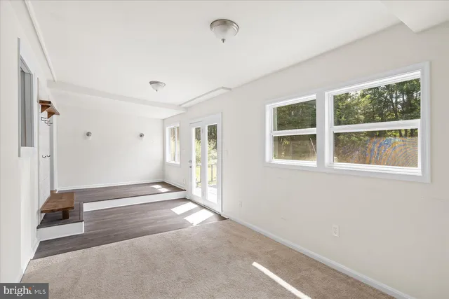 a view of empty room with windows