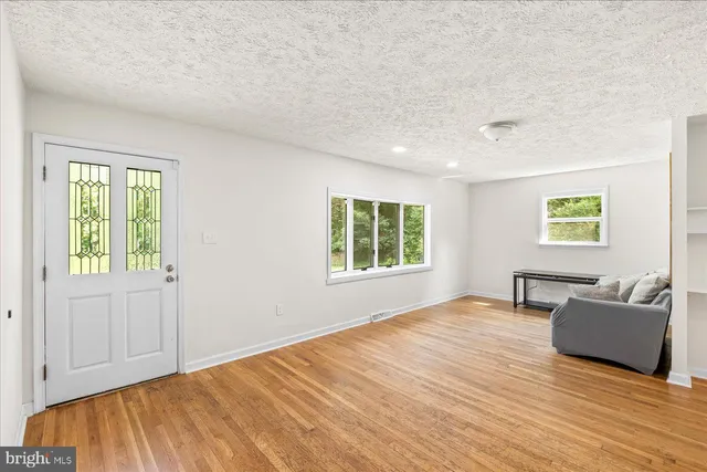 a view of livingroom with furniture and window