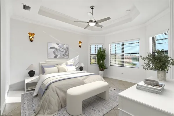 a bedroom with a bed and a couch