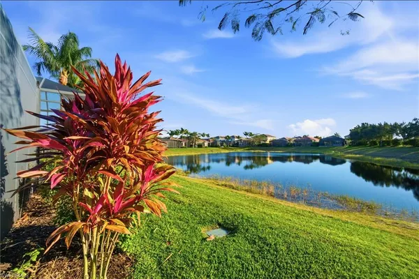 a view of a lake with a house in the background