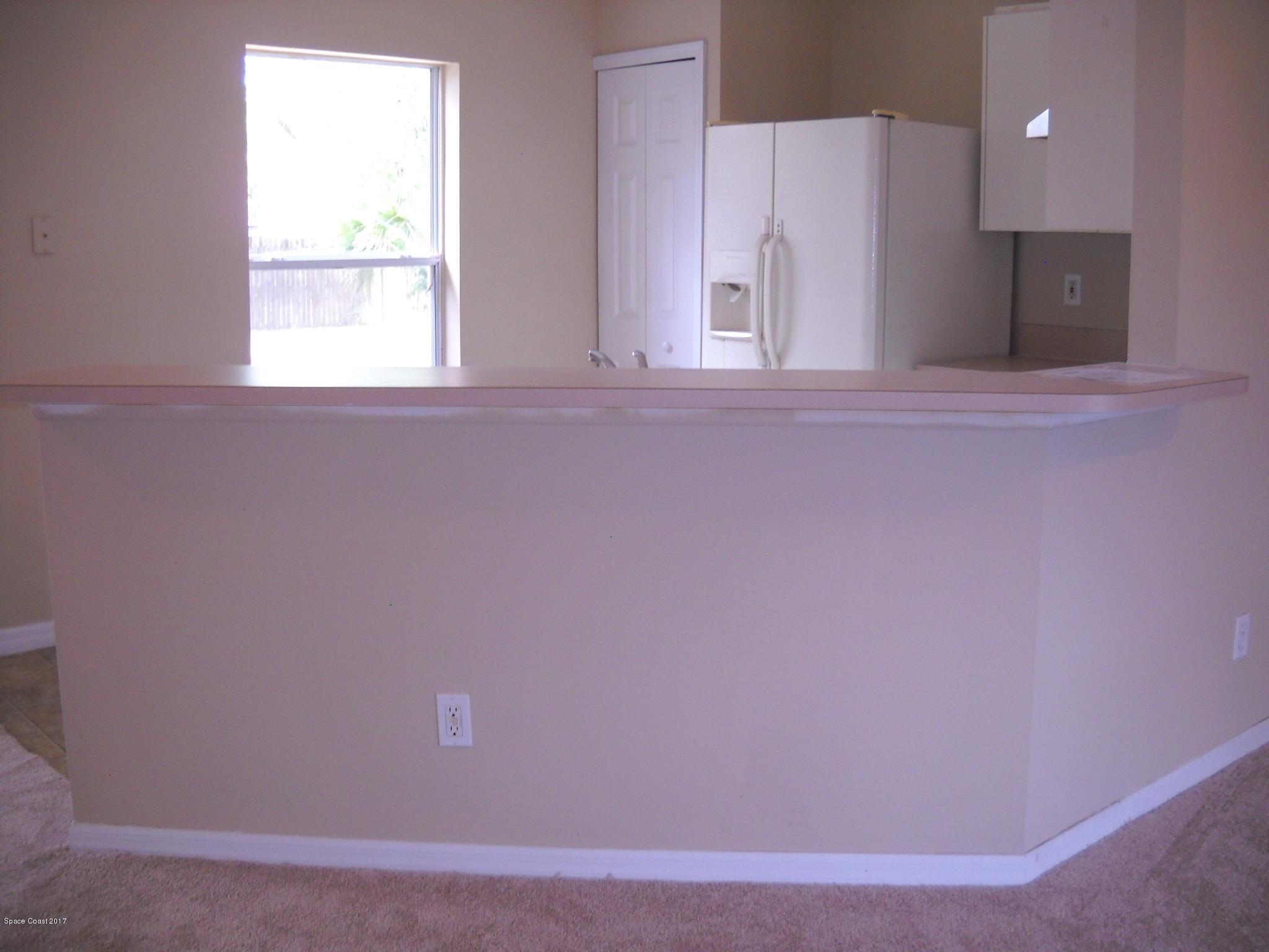 5660 Holden Road Cocoa, FL 32927 - Photo 4 of 21 Kitchen with breakfast bar view