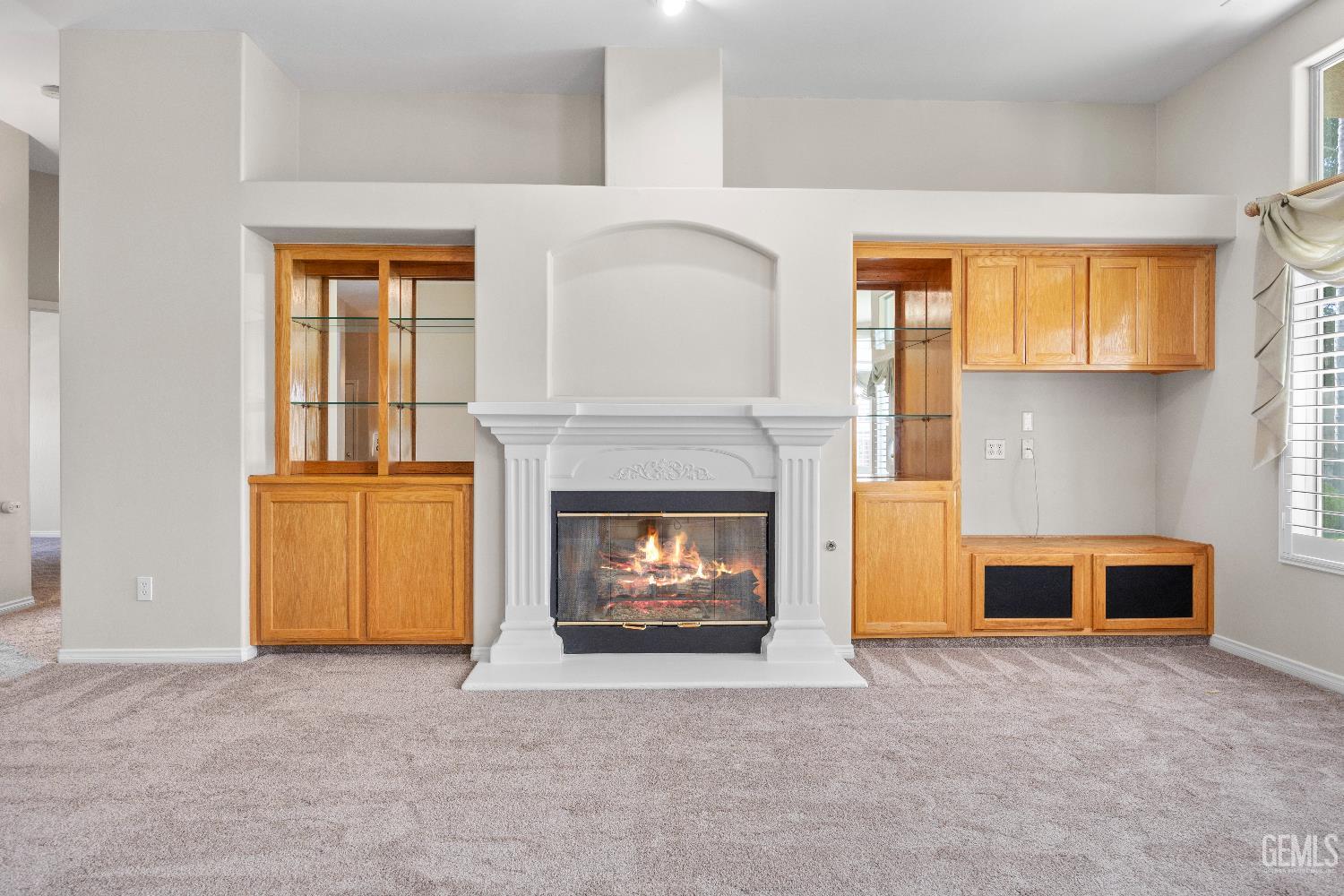 Undisclosed Address Bakersfield, CA 93312 - Photo 12 of 45 a living room with furniture and a fireplace