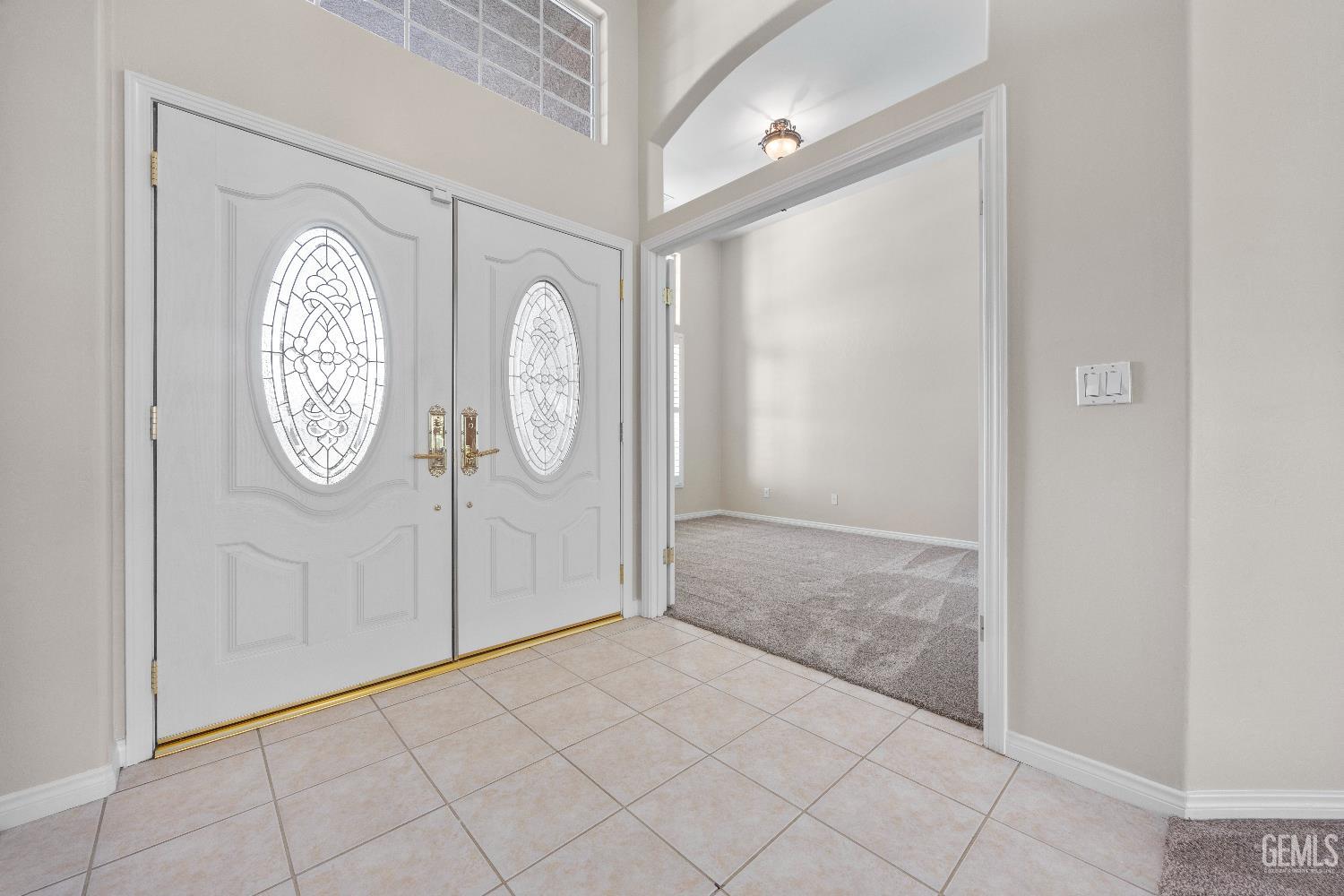 Undisclosed Address Bakersfield, CA 93312 - Photo 14 of 45 a area with a clock on the wall and a shower