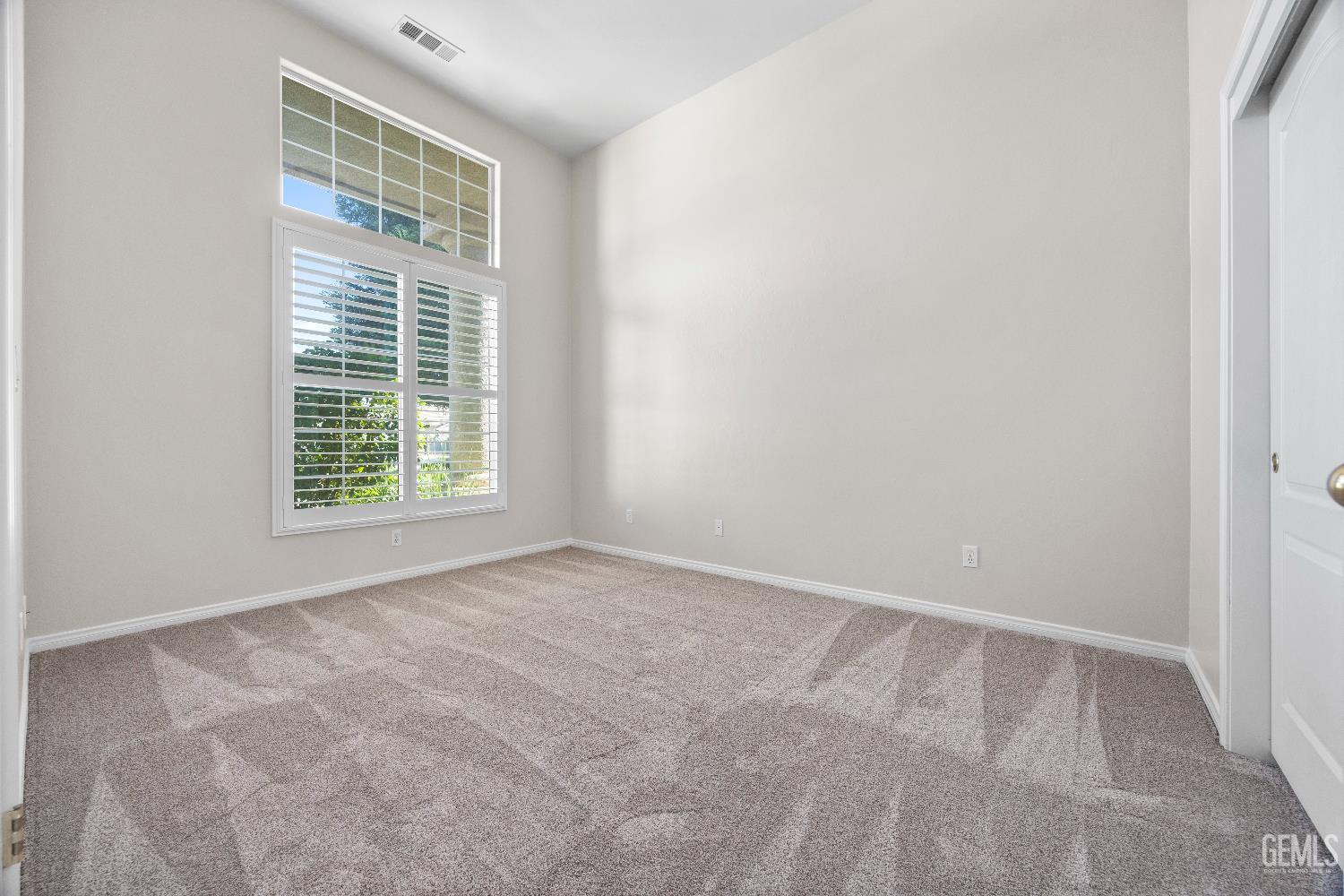 Undisclosed Address Bakersfield, CA 93312 - Photo 15 of 45 an empty room with windows